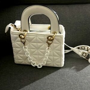 White mini hand bag great for jazzing up an outfit